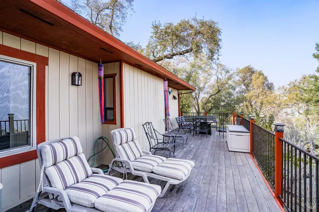 a outdoor living space with furniture and wooden floor