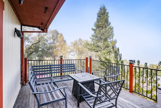 a view of a balcony with wooden floor