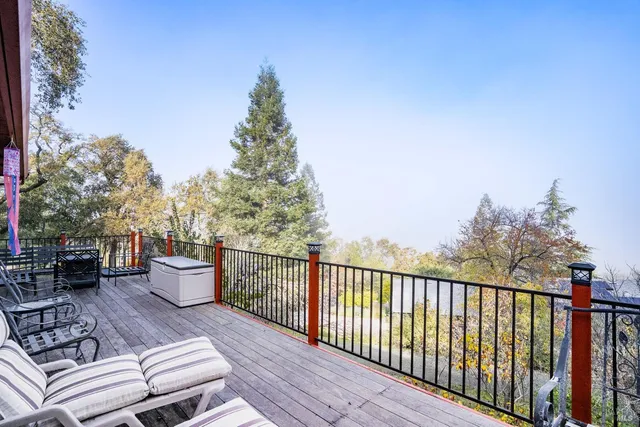 a view of a chairs and table in the balcony