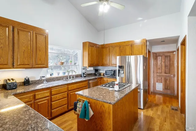 a kitchen with a sink a stove and cabinets