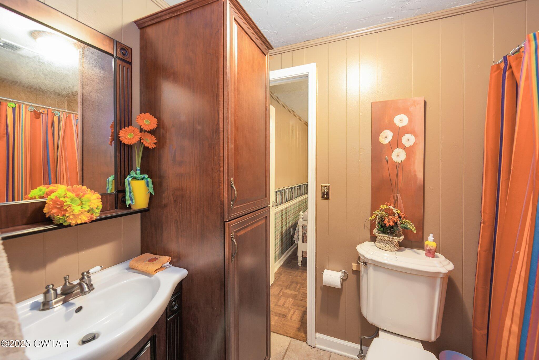 3600 Pine Top Road Toone, TN 38381 - Photo 22 of 39 a bathroom with a sink mirror and toilet