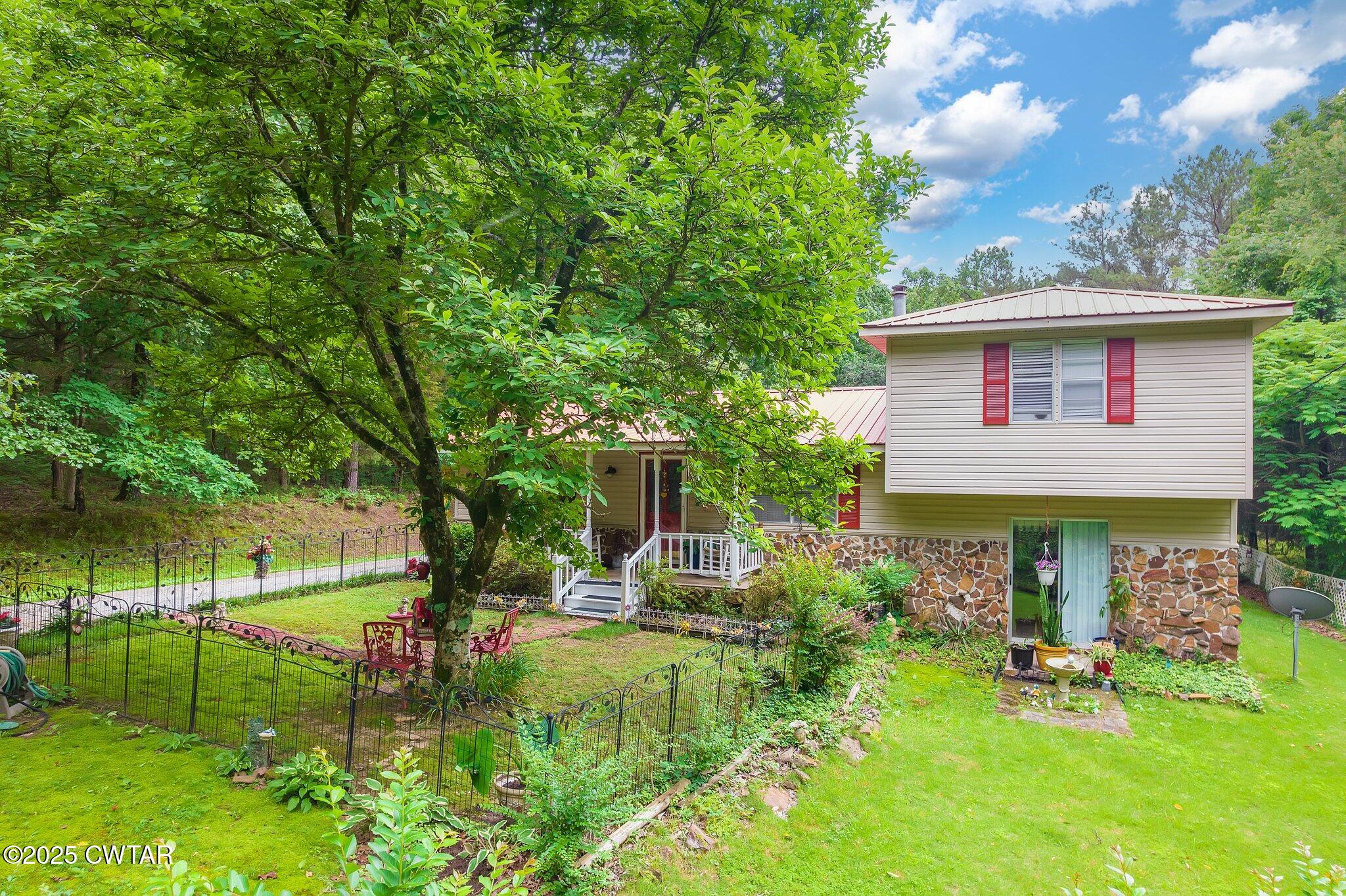3600 Pine Top Road Toone, TN 38381 - Photo 25 of 39 a front view of a house with garden