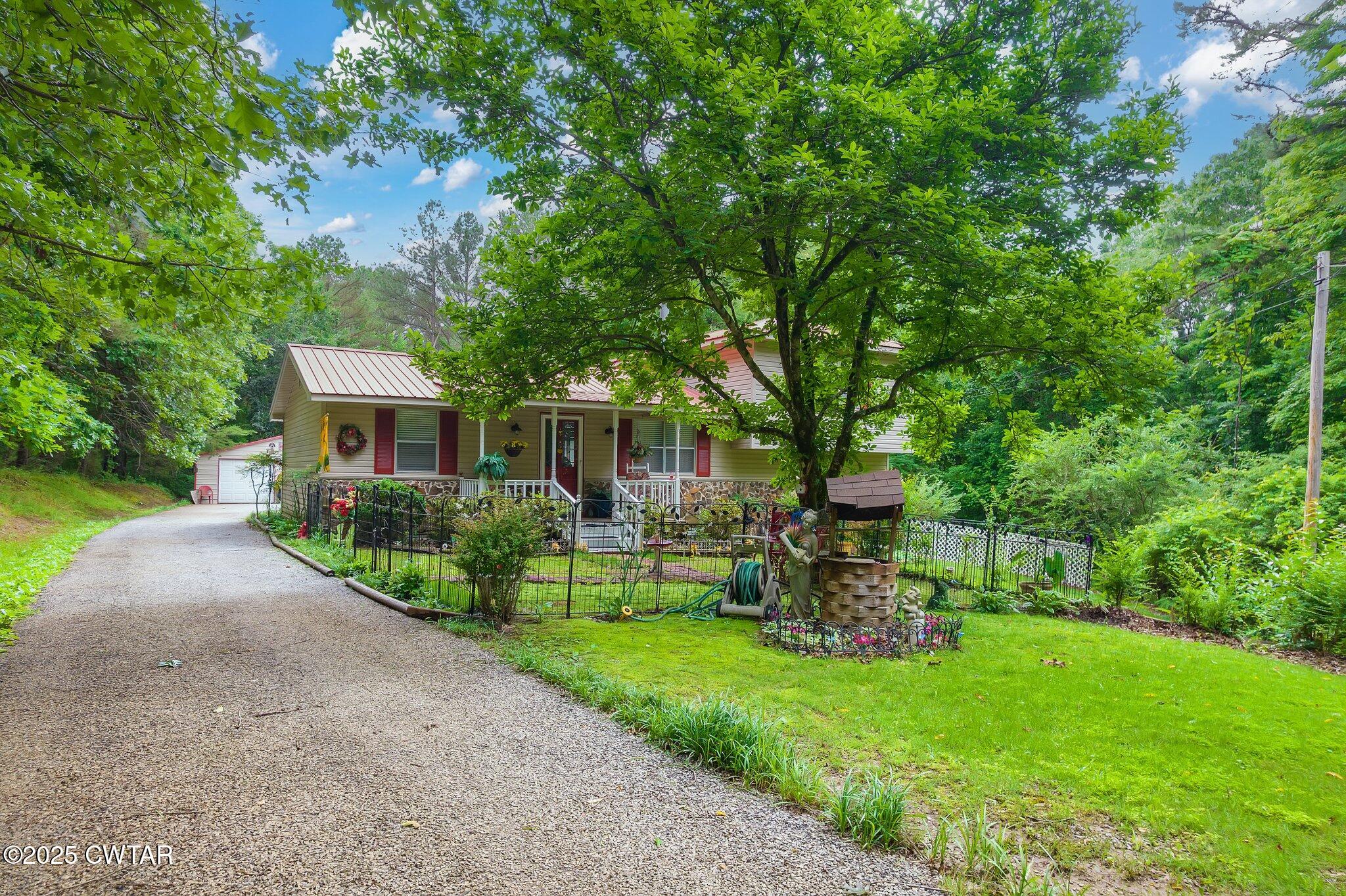 3600 Pine Top Road Toone, TN 38381 - Photo 3 of 39 a front view of a house with a yard and green space