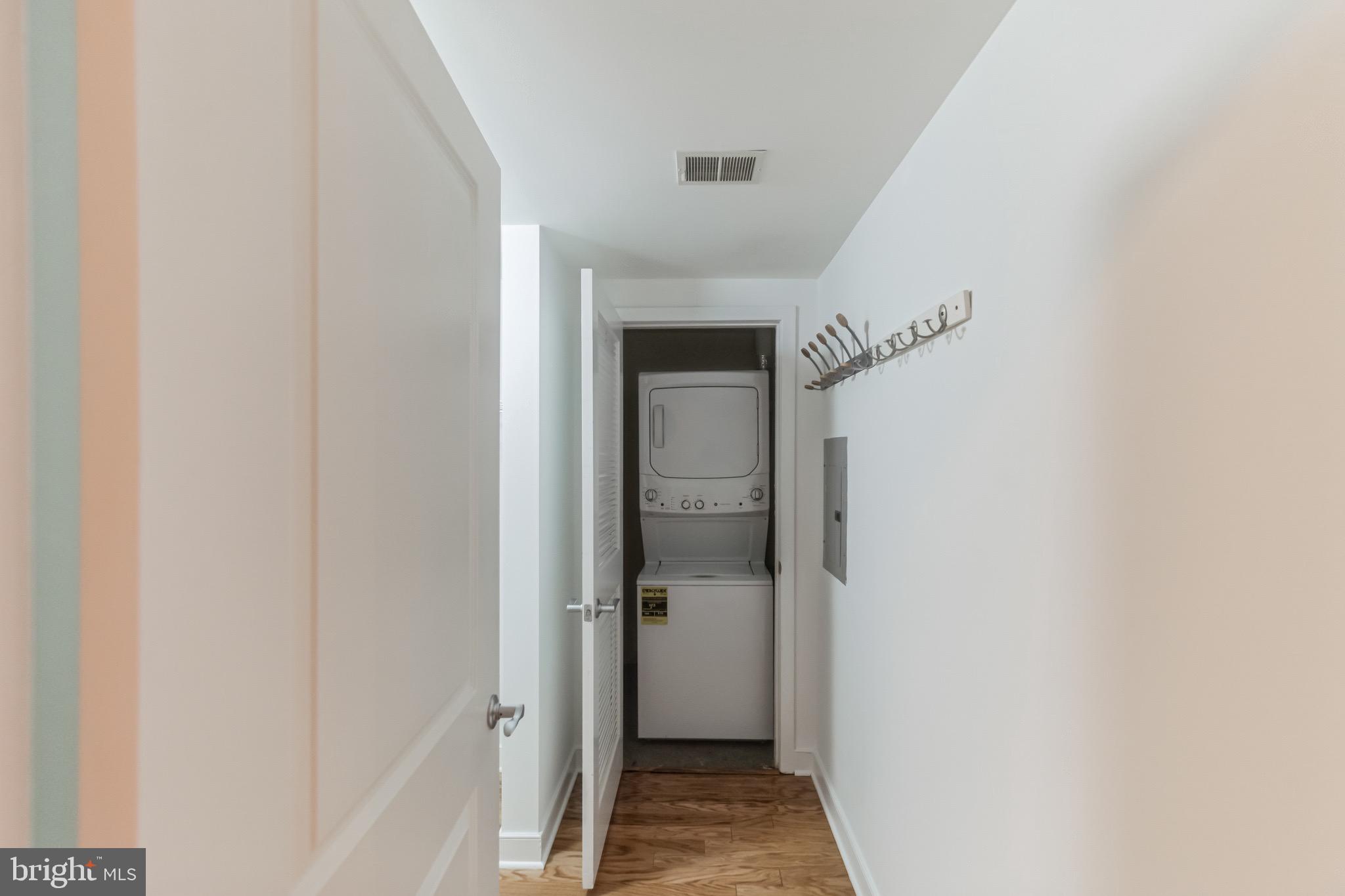1117 10th Street Northwest, Unit 607 Washington, DC 20001 - Photo 14 of 20 a view of a hallway with a wooden floor