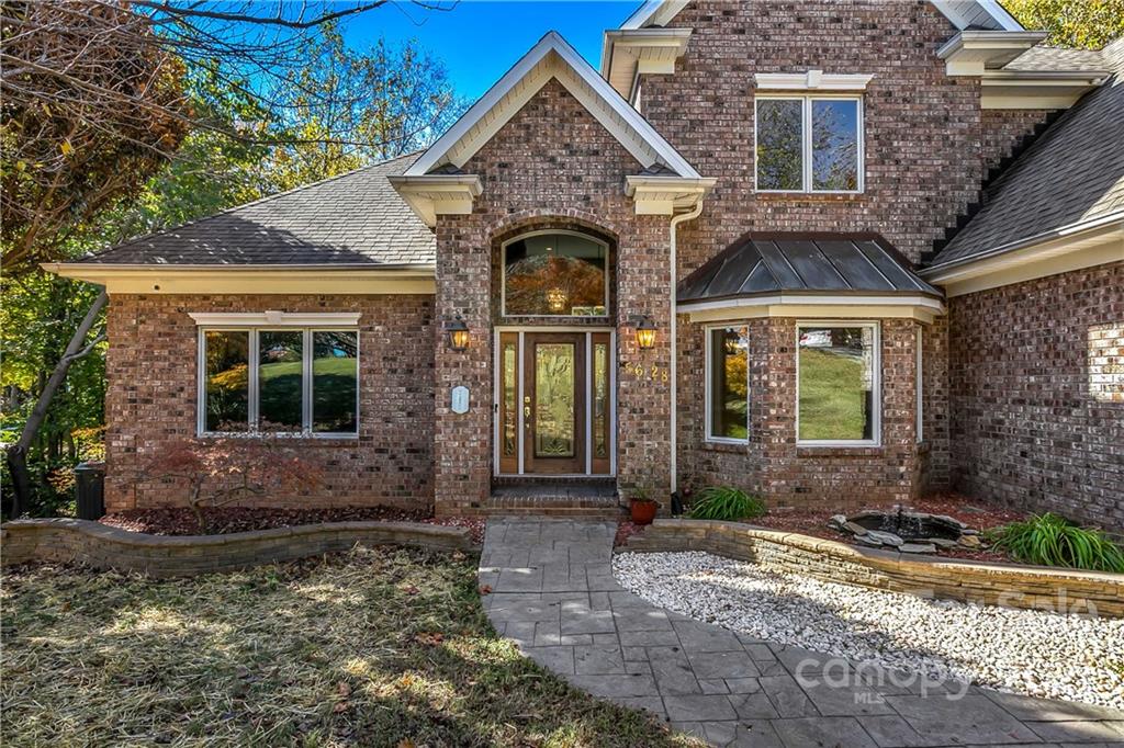 5628 Plantation Ridge Road Charlotte, NC 28214 - Photo 2 of 43 a front view of a house with garden