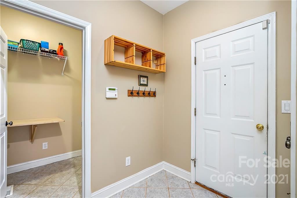 5628 Plantation Ridge Road Charlotte, NC 28214 - Photo 15 of 43 a view of a livingroom with wooden floor and closet
