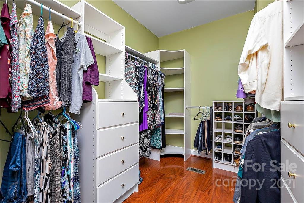 5628 Plantation Ridge Road Charlotte, NC 28214 - Photo 21 of 43 a view of walk in closet with clothes and shoes