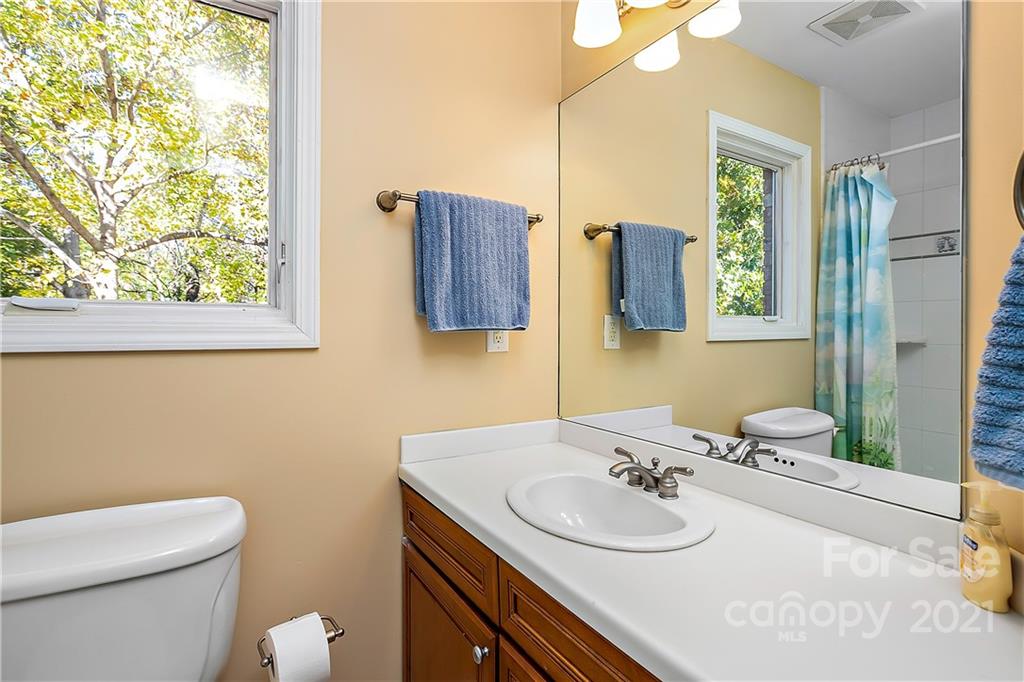 5628 Plantation Ridge Road Charlotte, NC 28214 - Photo 23 of 43 a bathroom with a sink and a toilet