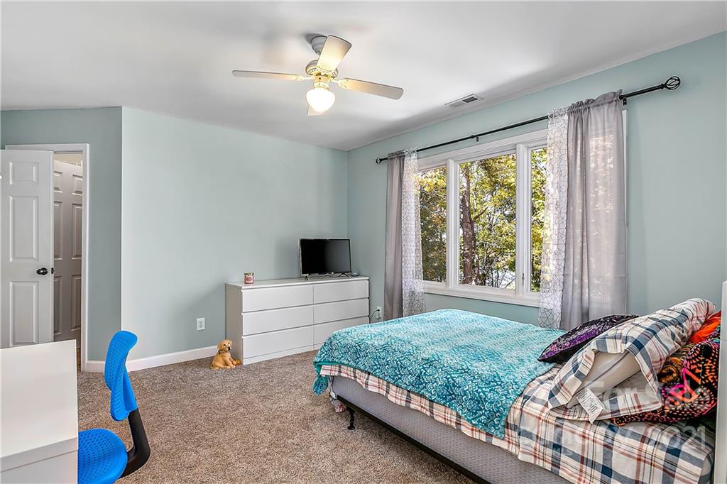 5628 Plantation Ridge Road Charlotte, NC 28214 - Photo 27 of 43 a bedroom with a bed and a window