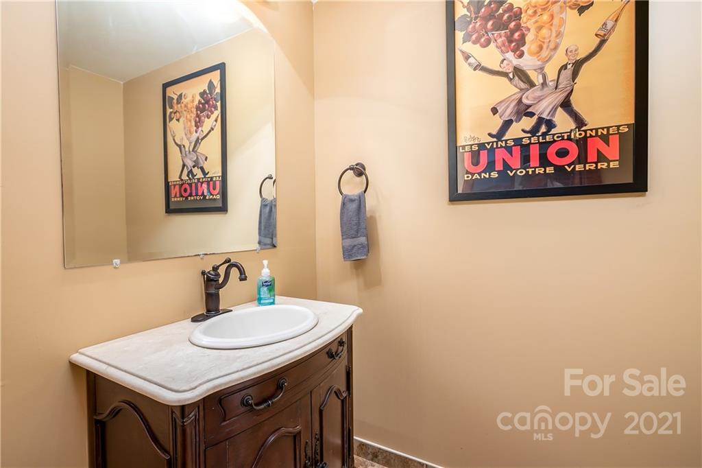 5628 Plantation Ridge Road Charlotte, NC 28214 - Photo 33 of 43 a bathroom with a sink vanity and a mirror