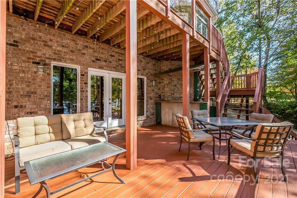 5628 Plantation Ridge Road Charlotte, NC 28214 - Photo 39 of 43 a view of a patio with a table and chairs
