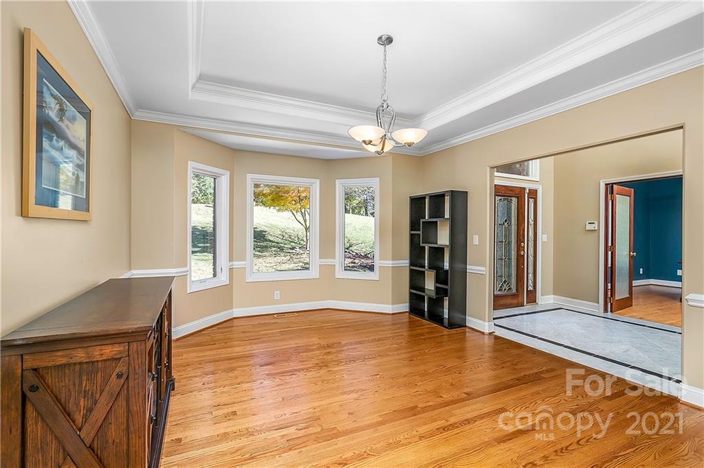 5628 Plantation Ridge Road Charlotte, NC 28214 - Photo 7 of 43 a view of a livingroom with wooden floor and furniture