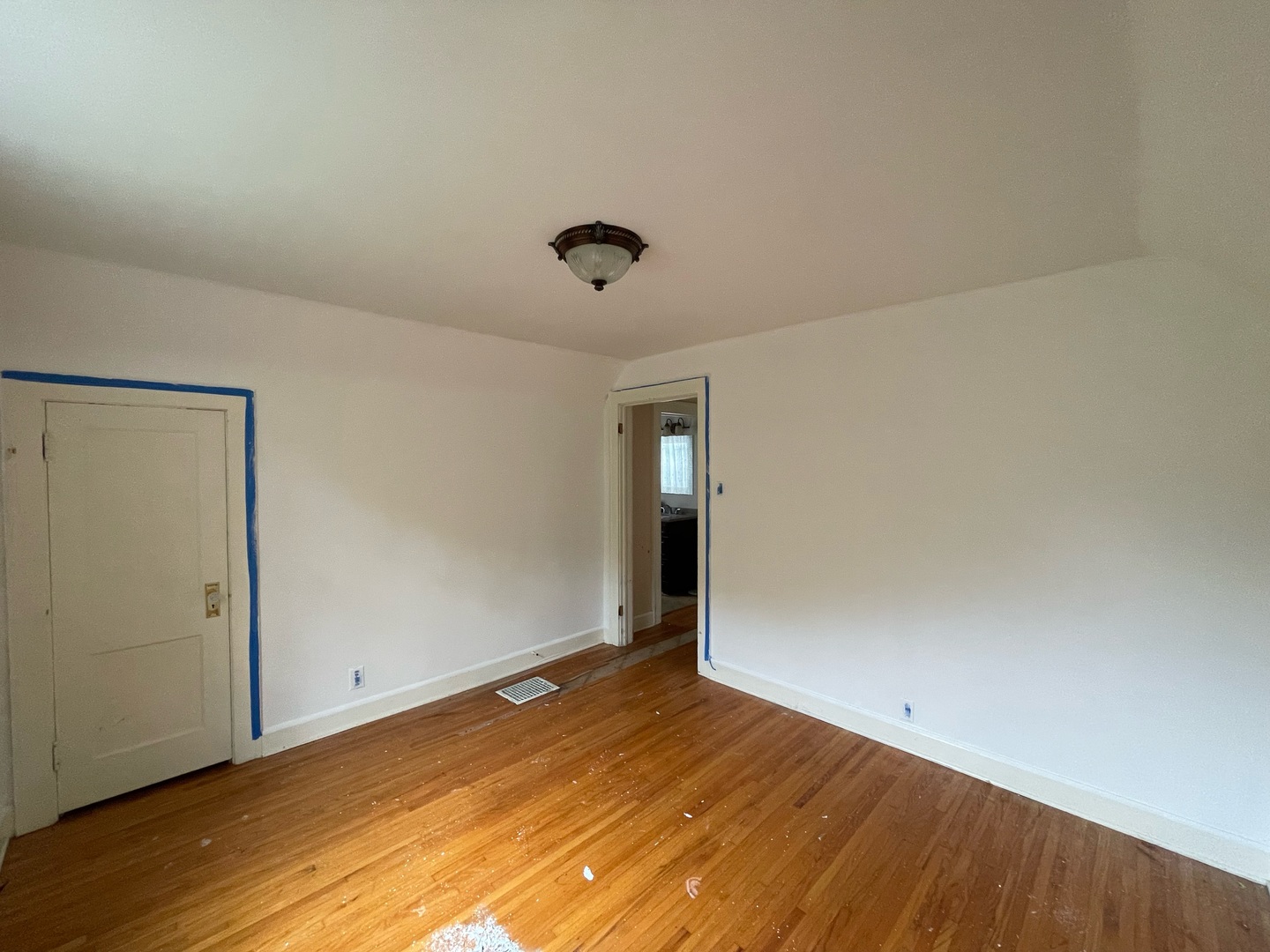 840 East Lincoln Street Hoopeston, IL 60942 - Photo 23 of 33 an empty room with wooden floor and windows