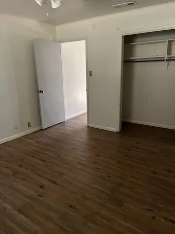 a kitchen with granite countertop a sink and a microwave