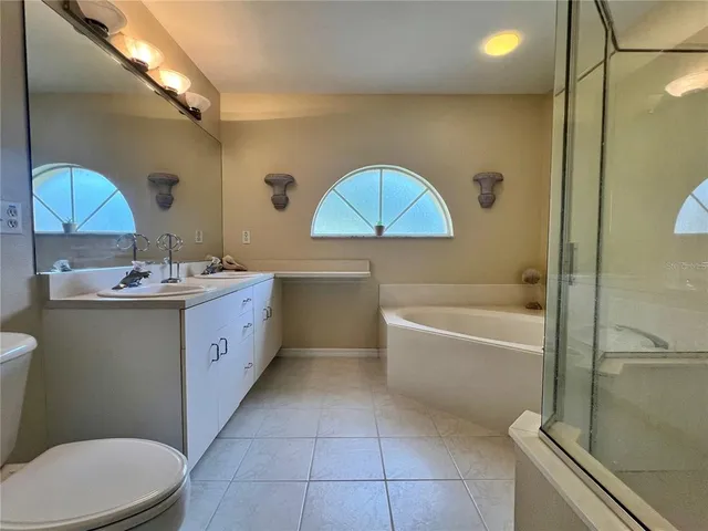 a bathroom with a sink a toilet and a bathtub