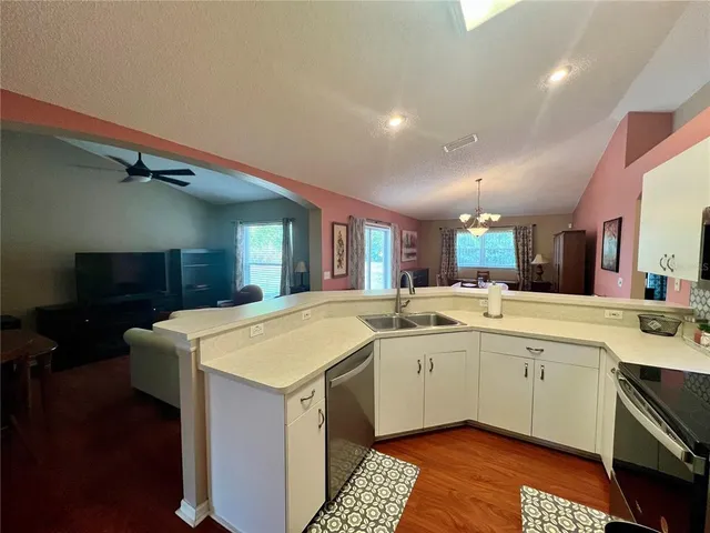 a kitchen with a sink and cabinets