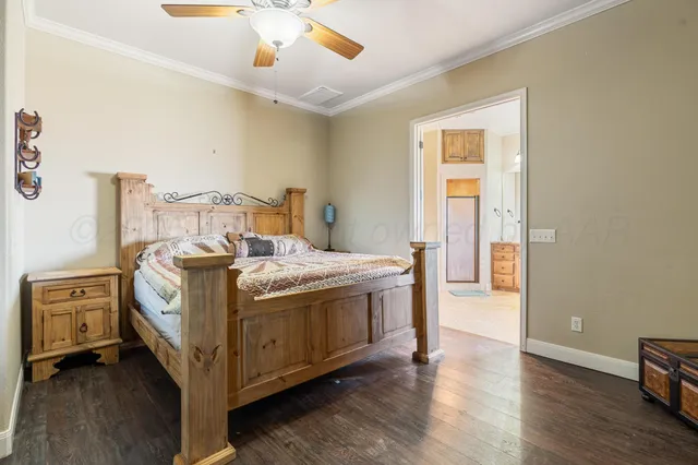 a bed room with a bed and a chandelier