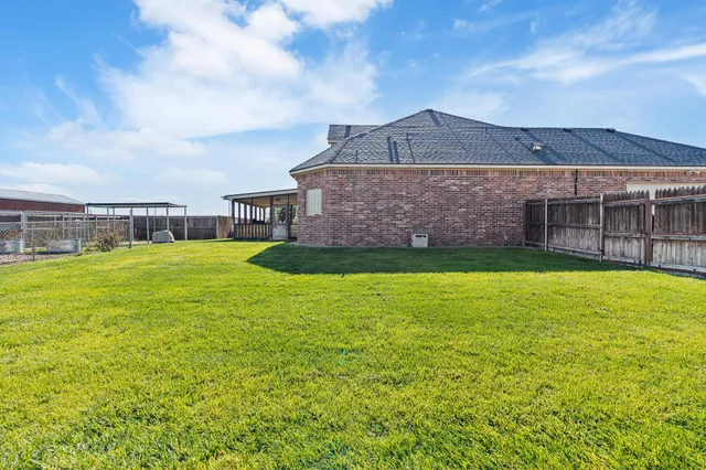 a house with trees in the background