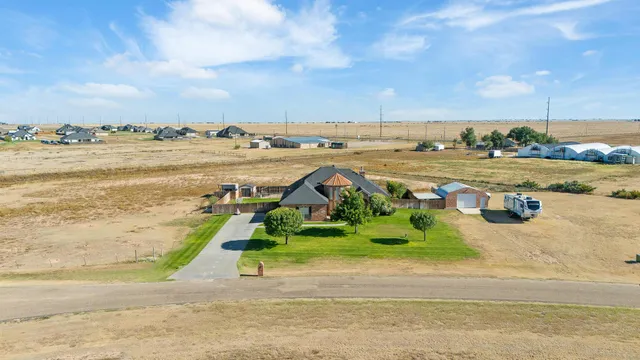 an aerial view of a house with a ocean view