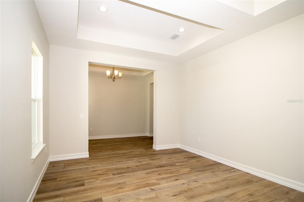 3970 Southern Valley Loop Brooksville, FL 34601 - Photo 20 of 55 an empty room with wooden floor and closet