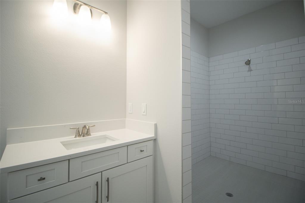 3970 Southern Valley Loop Brooksville, FL 34601 - Photo 26 of 55 a bathroom with a sink a shower and a vanity