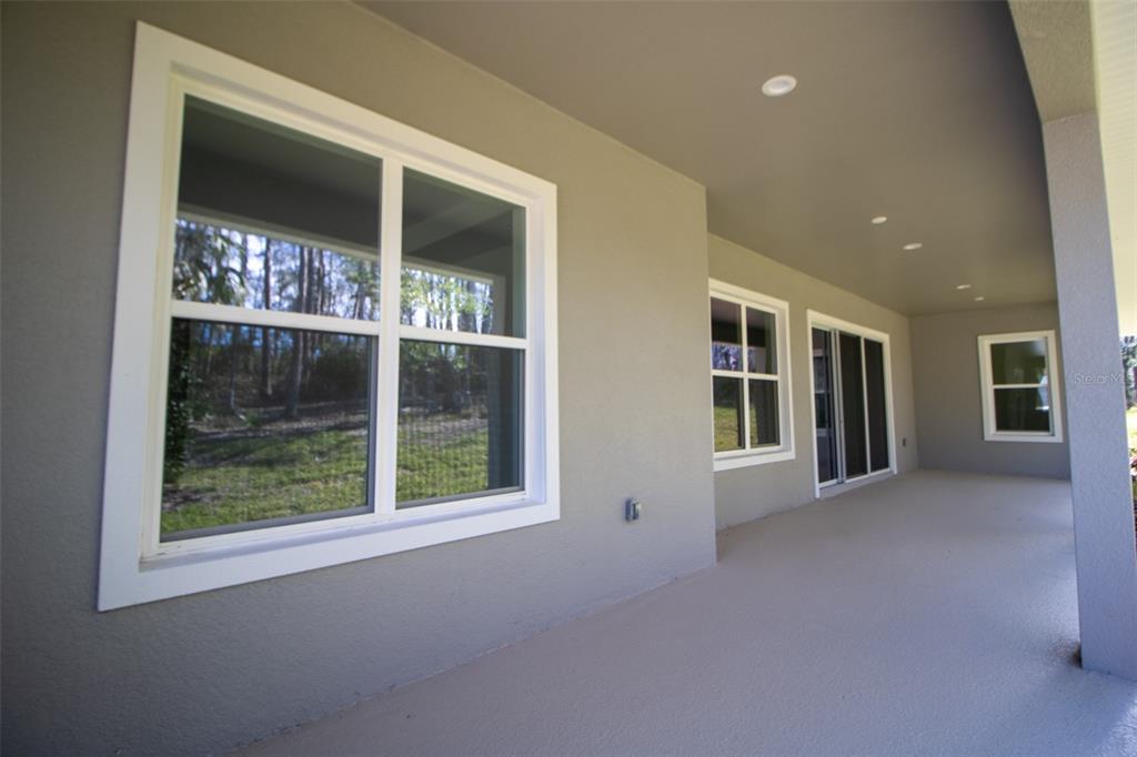 3970 Southern Valley Loop Brooksville, FL 34601 - Photo 42 of 55 wooden floor in an empty room with a window
