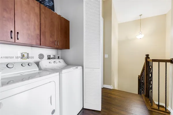 a view of storage and utility room with washer and dryer