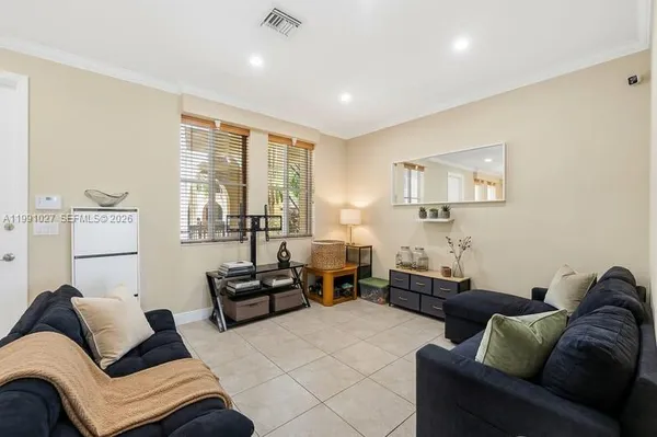 a living room with furniture and a large window