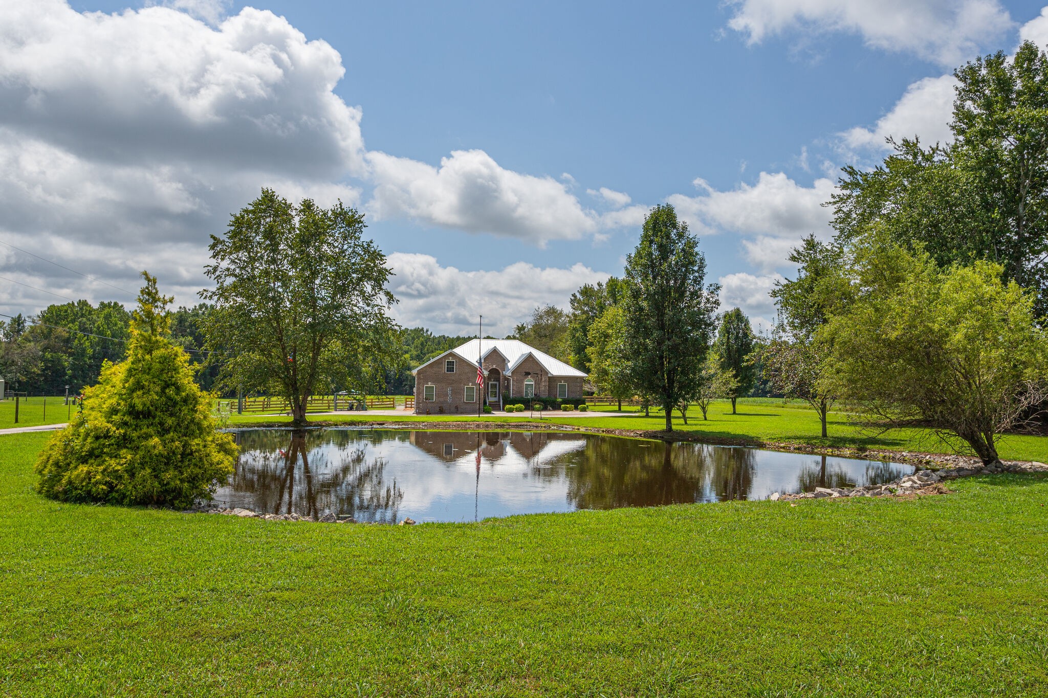 481 Matts Hollow Road Manchester, TN 37355 - Photo 1 of 42 a view of a lake with houses in the background