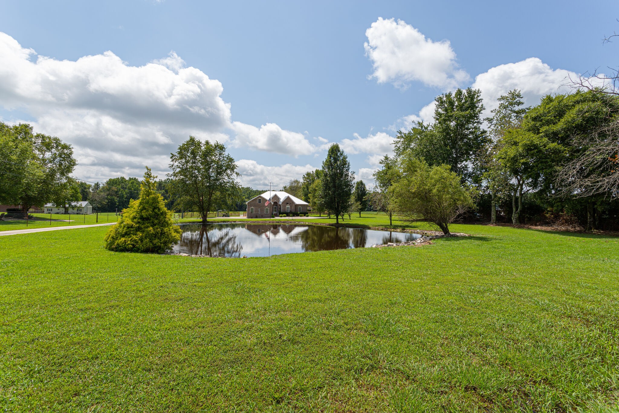 481 Matts Hollow Road Manchester, TN 37355 - Photo 2 of 42 a view of a golf course with a lake