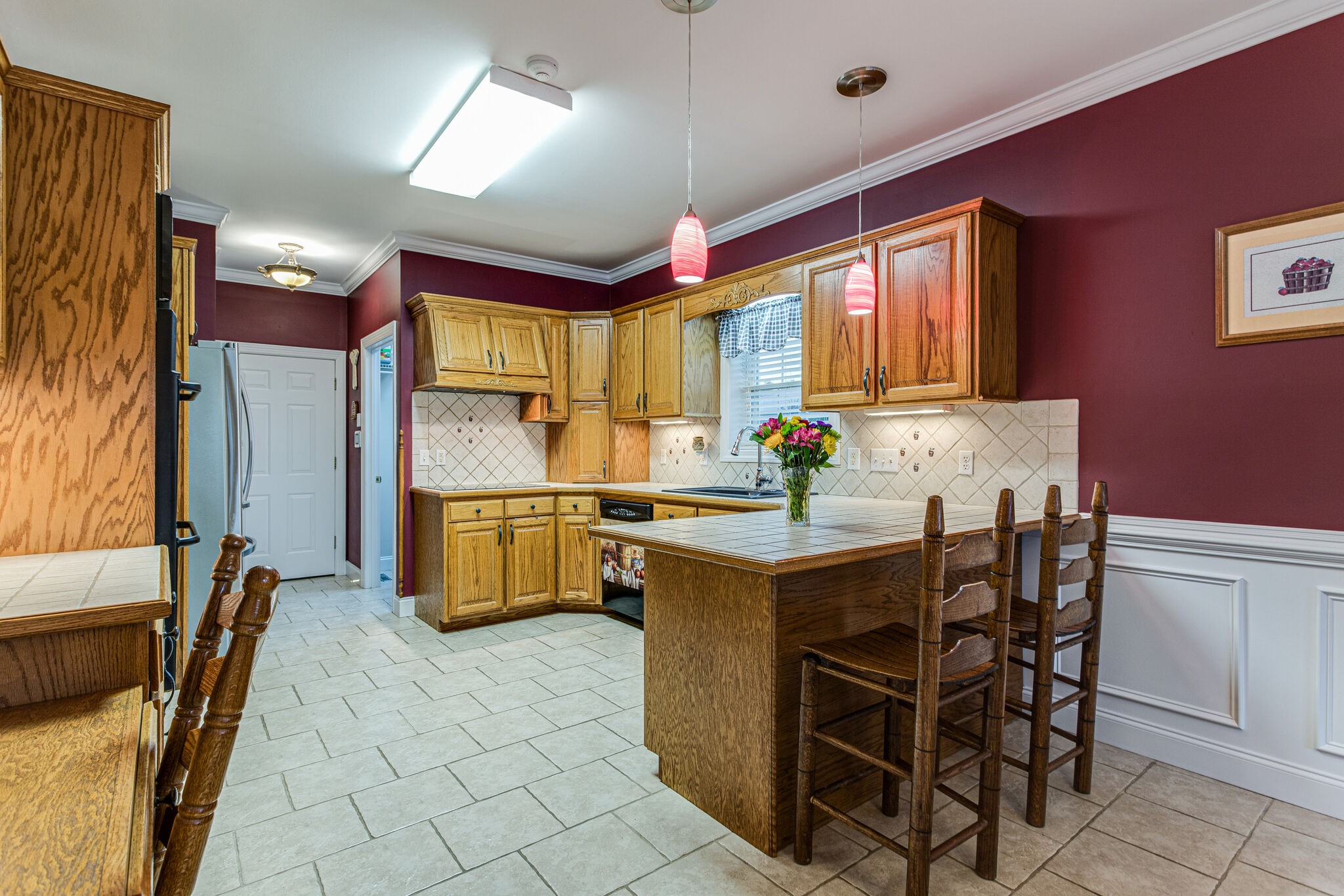 481 Matts Hollow Road Manchester, TN 37355 - Photo 15 of 42 a kitchen with a sink and chairs