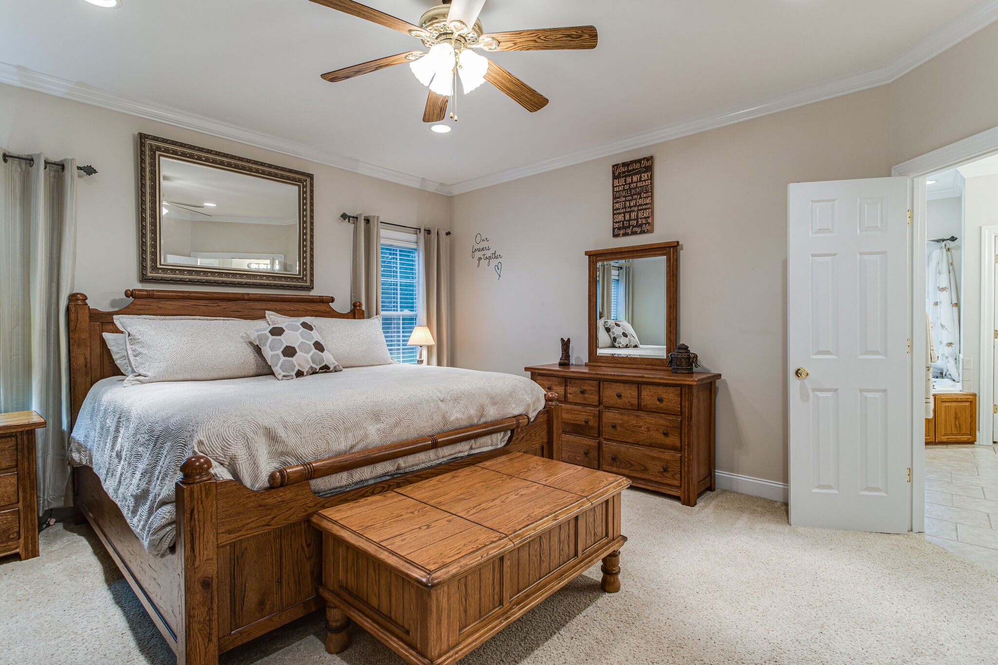481 Matts Hollow Road Manchester, TN 37355 - Photo 22 of 42 a bedroom with a bed and a chandelier