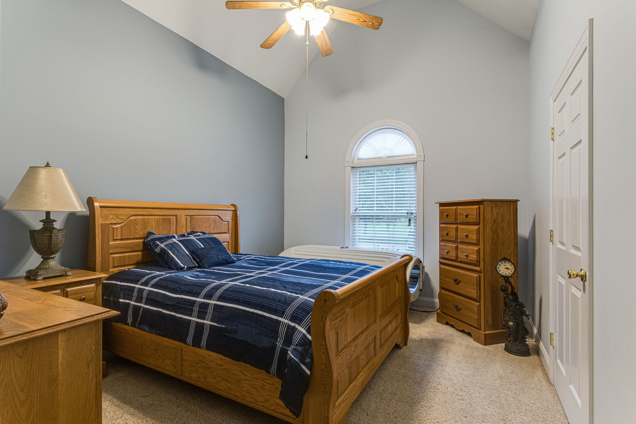 481 Matts Hollow Road Manchester, TN 37355 - Photo 26 of 42 a bedroom with a bed and a chandelier