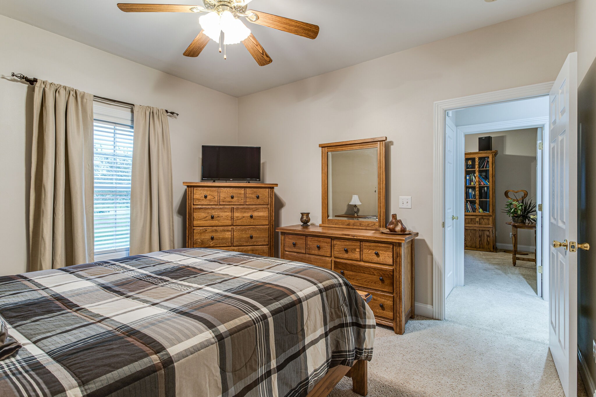 481 Matts Hollow Road Manchester, TN 37355 - Photo 30 of 42 a bedroom with a large bed and a chandelier