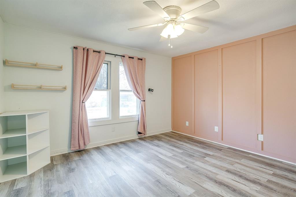 206 Bateman Street Meridian, TX 76665 - Photo 19 of 26 an empty room with windows and closet