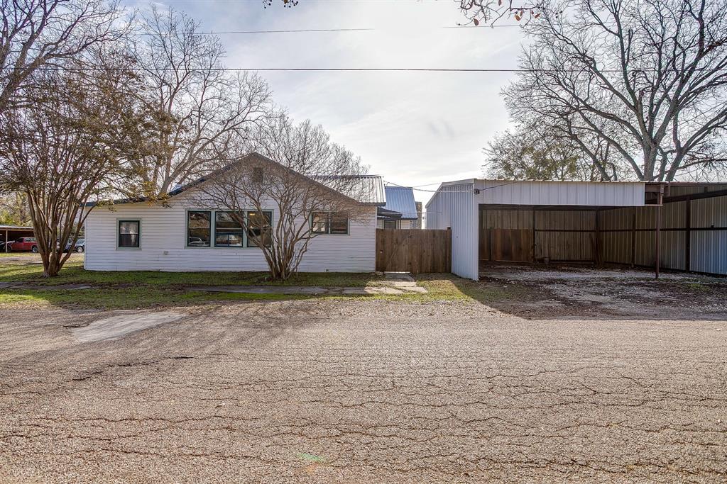 206 Bateman Street Meridian, TX 76665 - Photo 23 of 26 a view of a house with a yard