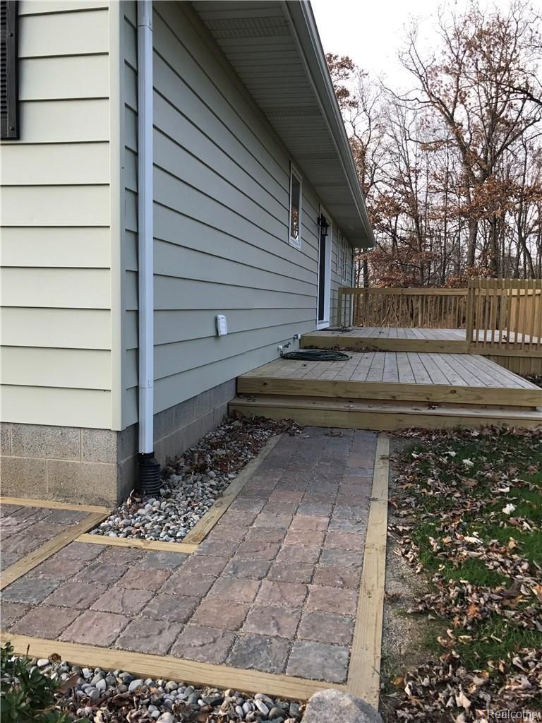 570 North Kellogg Road Howell, MI 48843 - Photo 38 of 40 Brick paver walkways and new decks.
