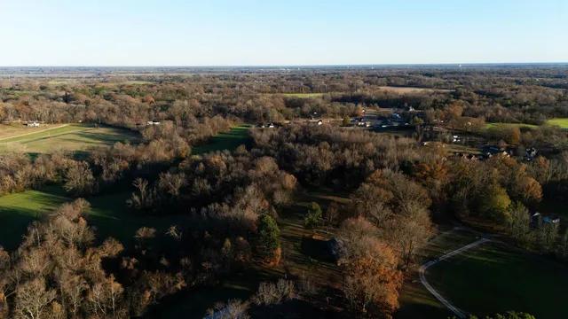 an aerial view of house with yard