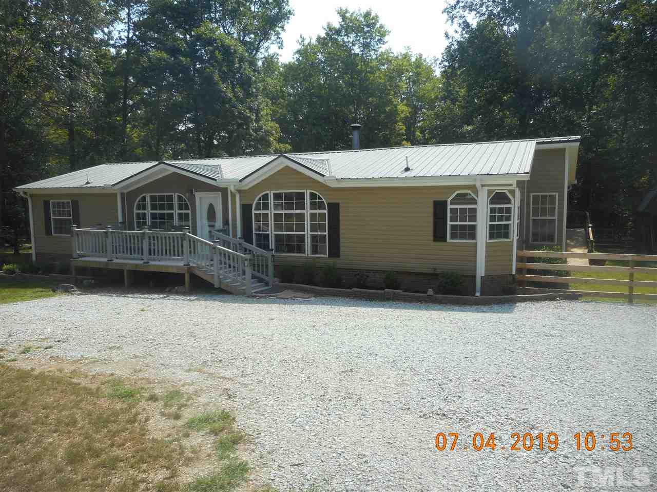 301 Mountain Ridge Road Rougemont, NC 27572 - Photo 1 of 22 front view of a house with a yard