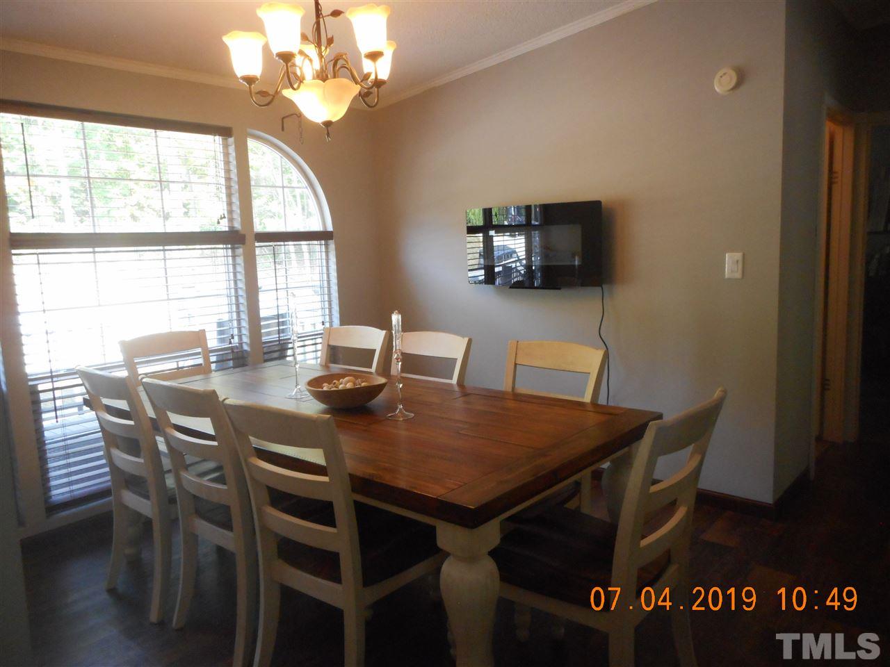 301 Mountain Ridge Road Rougemont, NC 27572 - Photo 15 of 22 a view of a dining table and chairs in a room