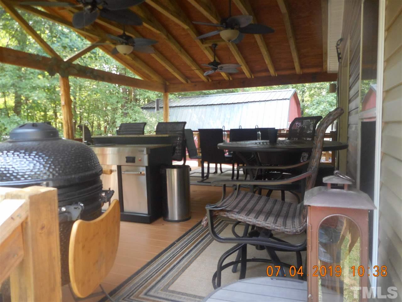 301 Mountain Ridge Road Rougemont, NC 27572 - Photo 5 of 22 a view of an outdoor space with seating