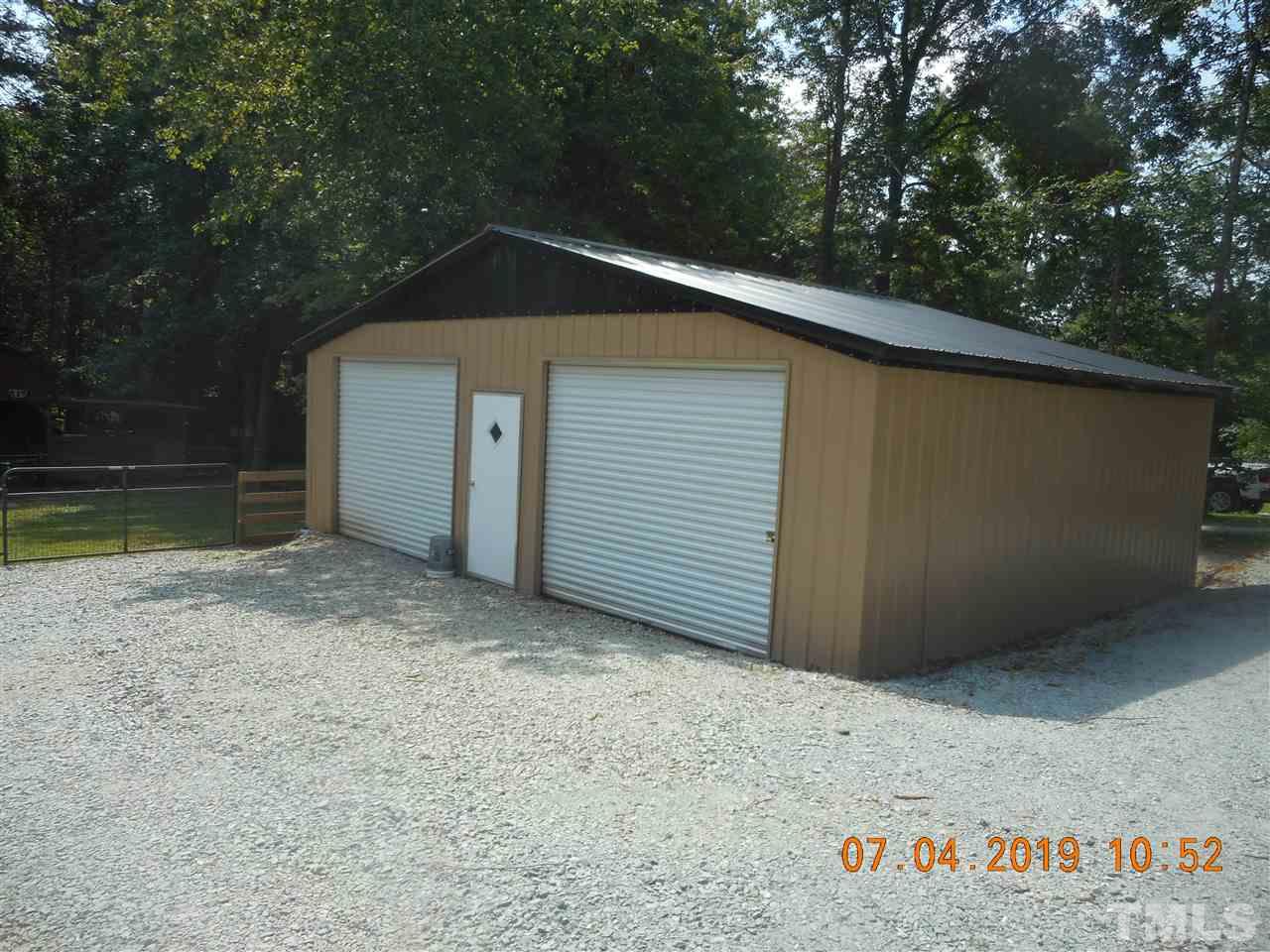 301 Mountain Ridge Road Rougemont, NC 27572 - Photo 8 of 22 a backyard of a house