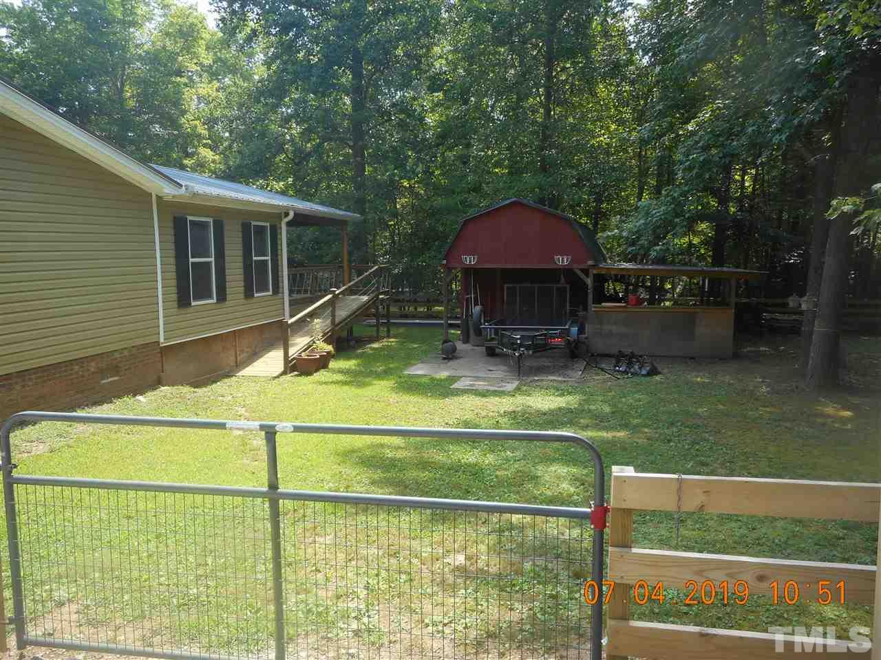 301 Mountain Ridge Road Rougemont, NC 27572 - Photo 9 of 22 a view of a house with a yard