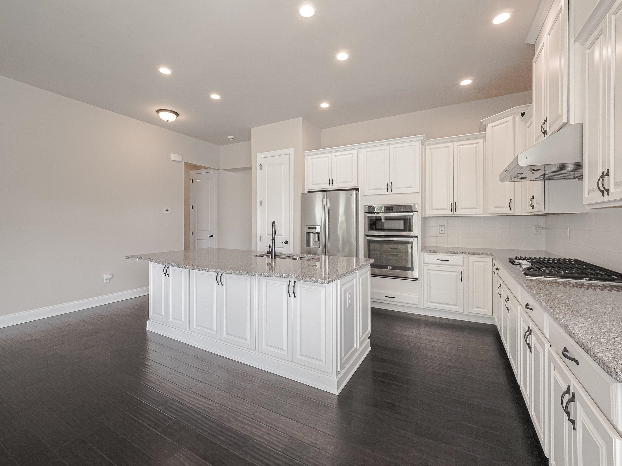 2619 Beckwith Road Apex, NC 27523 - Photo 13 of 46 How many barstools will fit around this island?