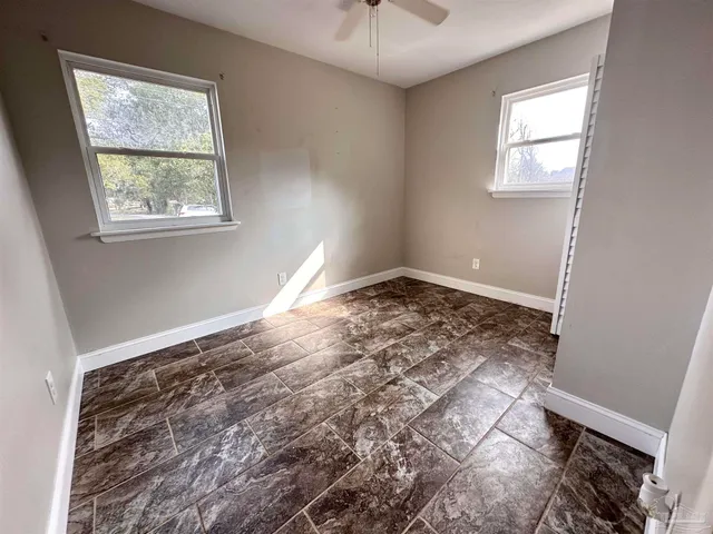 a view of empty room with windows