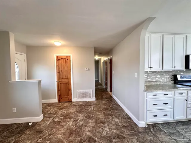 a view of cabinets and window