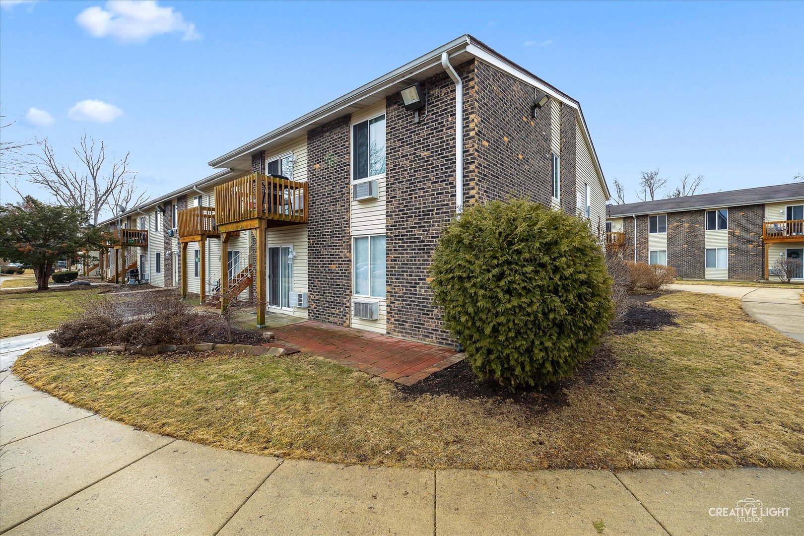 2600 Light Road, Unit 106 Oswego, IL 60543 - Photo 11 of 12 a view of a house with a yard