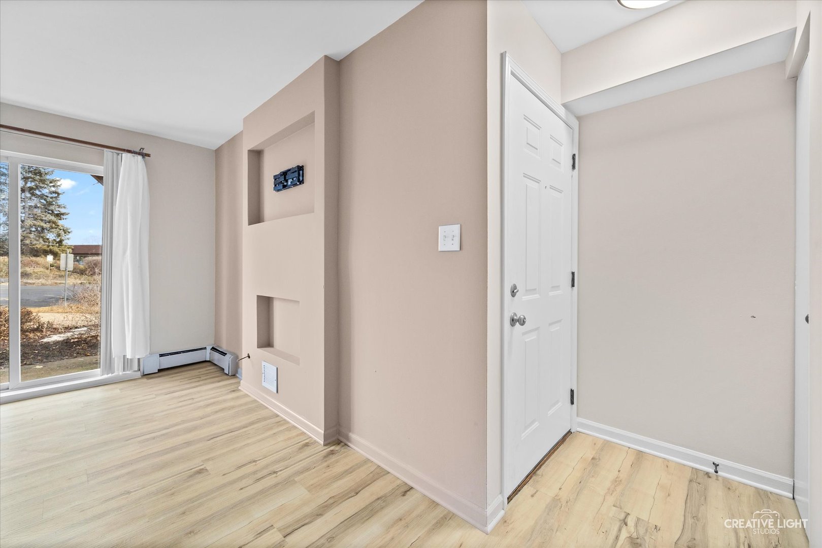 2600 Light Road, Unit 106 Oswego, IL 60543 - Photo 3 of 12 a view of a room with wooden floor and a bathroom