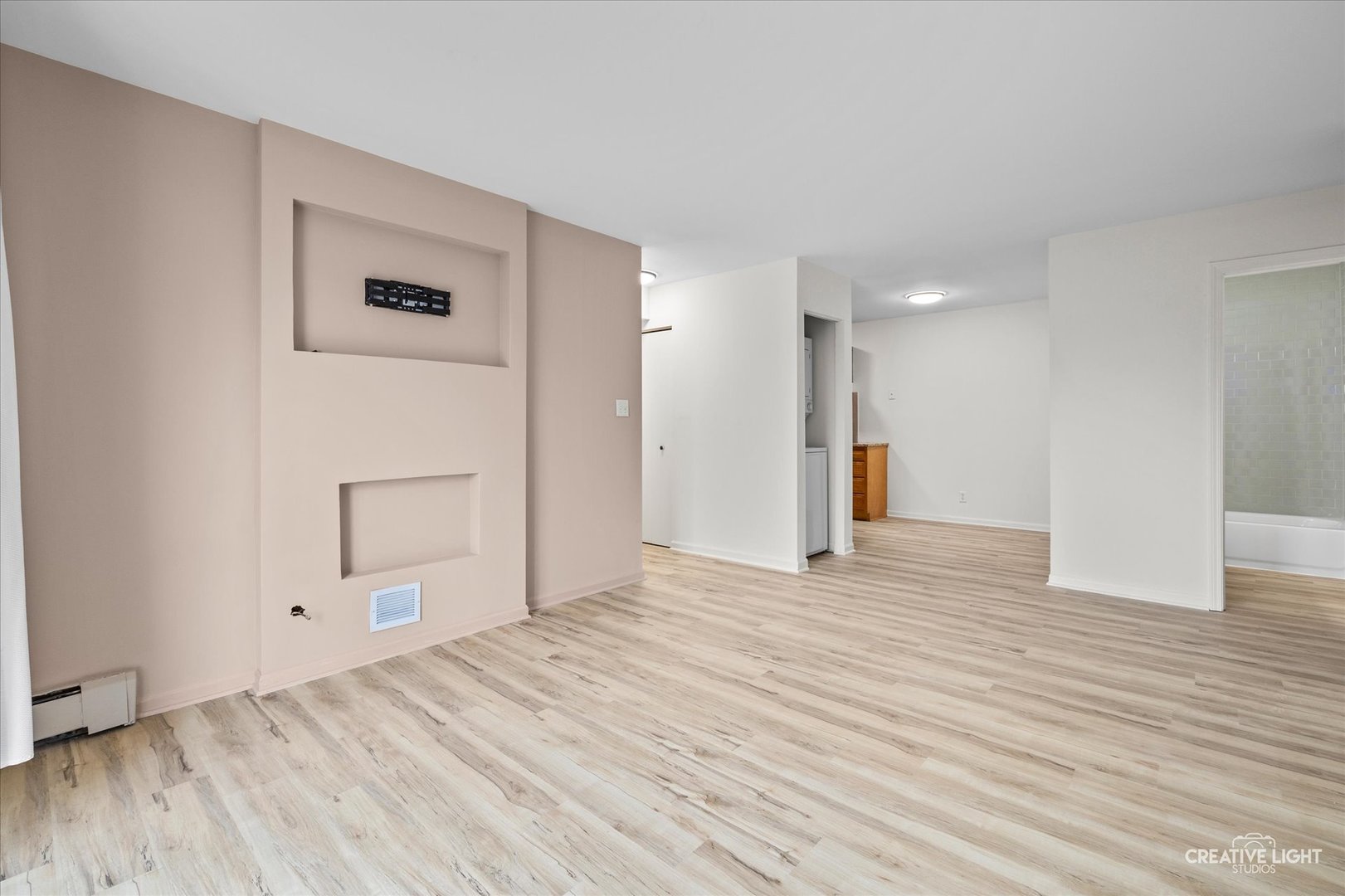 2600 Light Road, Unit 106 Oswego, IL 60543 - Photo 5 of 12 a view of empty room with wooden floor