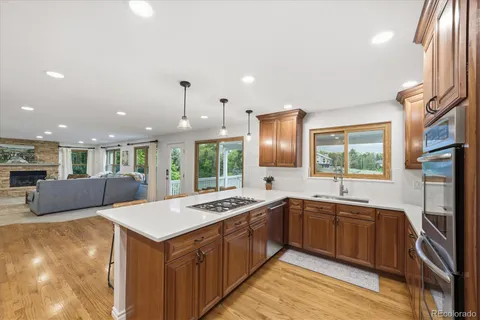 a kitchen with a sink stove and cabinets